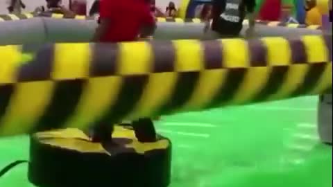 Kid gets hit by spinning thing