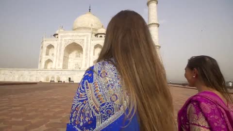 Orbiting Shot of Two Women at the Taj Mahal