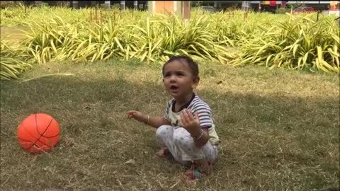 Cute baby playing in garden-baby behavior