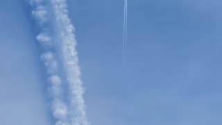 Contrail under a chemtrail, see difference