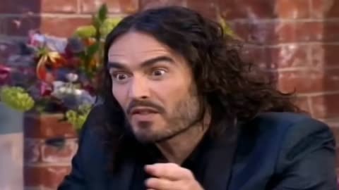 RUSSELL BRAND SHAPESHIFTING & REPTILIAN EYES DURING LIVE BROADCAST