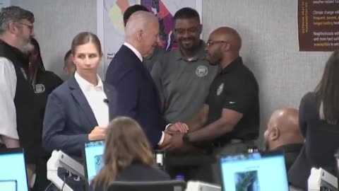 Biden Awkwardly Caresses Man's Arm After Shaking His Hand