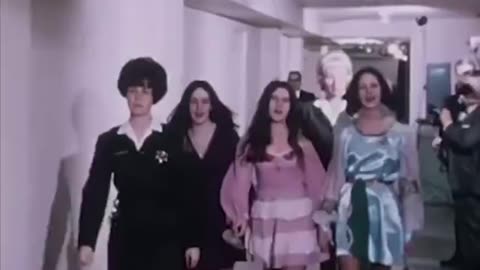The Manson girls singing on the way to their trial
