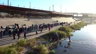 Drone footage shows long queue of migrants near U.S. border