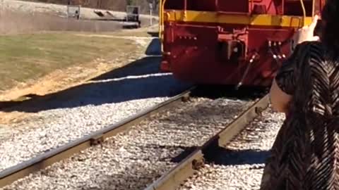 Vintage Train Arrives At Station With Excited Onlookers.