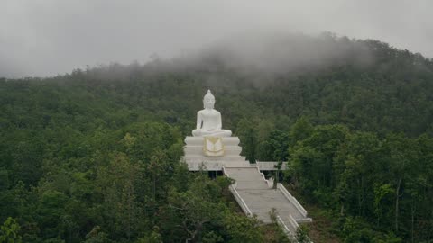 "Exploring the Majestic Pai White Large Buddha Statue on Hill in Thailand". Thisand That Florida USA