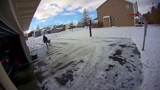 Woman Slips on Black Ice in Front of Garage