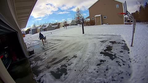 Woman Slips on Black Ice in Front of Garage