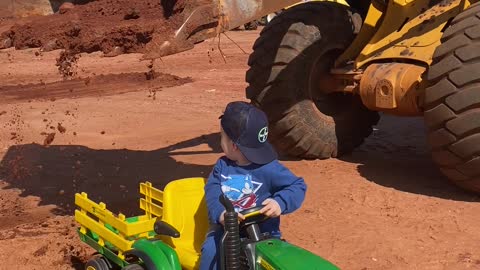 Boy Gets Toy Tractor Loaded by Real Excavator