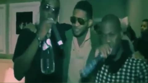 Diddy claps Usher's cheeks in his kitchen, eating his cereal?