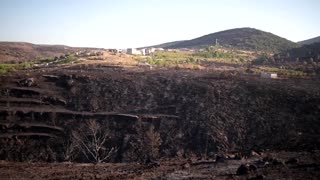 Wildfire in Spain leaves scorched earth and homes
