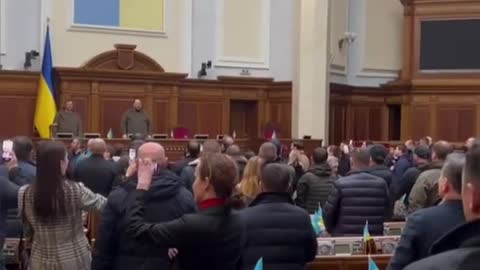 StoryiunMembers of the Ukrainian Parliment sing thein national anthem at a security meeting in Kyiv