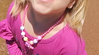 Adorable young girl at the beach