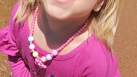 Adorable young girl at the beach