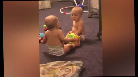 Cute Twin Baby Girls Argue Over