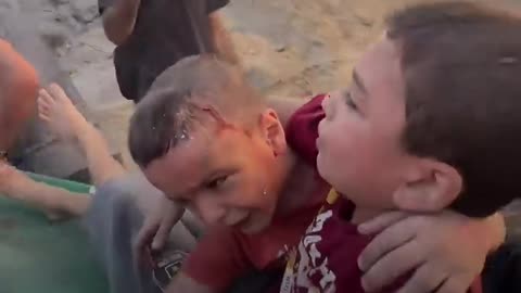 Palestinian brothers from Gaza thank paramedics for their rescue..
