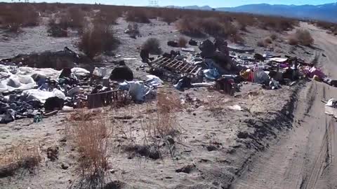 trashing earth = the massive amounts of discarded trash in desolate areas of socal