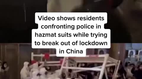 Video shows residents confronting police in hazmat suits while trying to break out of lockdown