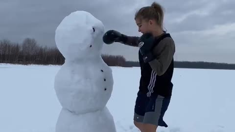 girl playing with ice in cold weather