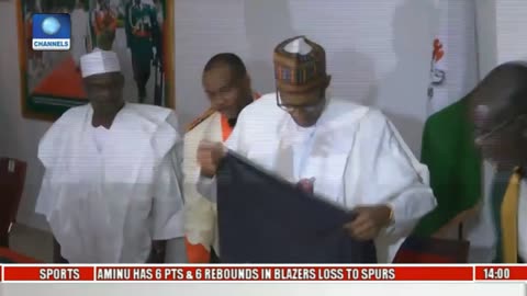 Buhari Receives Captured Boko Haram Flag