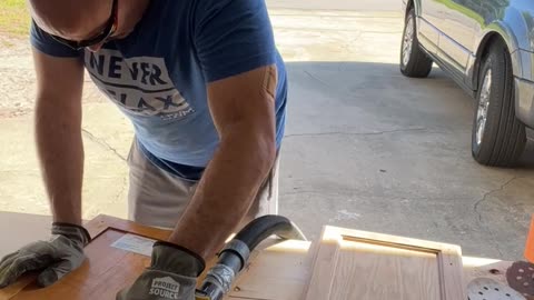 10x speed video of a cabinet door being sanded