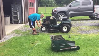 Daniel repairing dads Craftsman mower. (Broken main pulley)