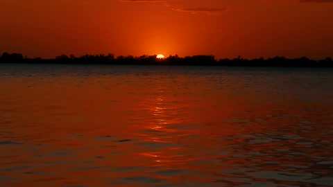 Sunset red calm sea waves