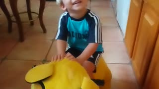 Toddler playing with lion