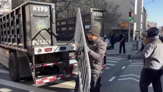 Crowd fencing going up in front of manhattan court.