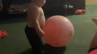 Kid Lands Headfirst on Toy Ball