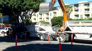 Dump truck gets filled with dirt