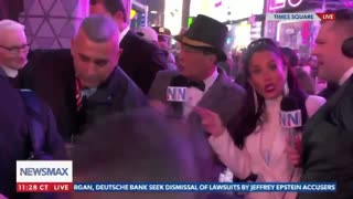Anderson Cooper and CNN security team photobomb Newsmax live shot on New Year's eve, pushing people out of the way