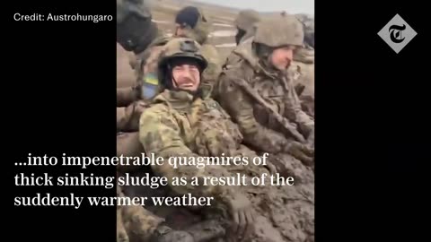 Ukrainian soldier forced to take icy dip to rescue ammo from flooded trench amid spring thaw