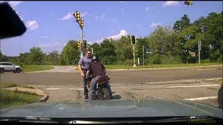 Massachusetts State Police dash cam shows teen on a motorcycle push a trooper into traffic
