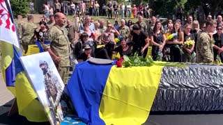 Relatives, friends cry at funeral of Ukrainian soldier