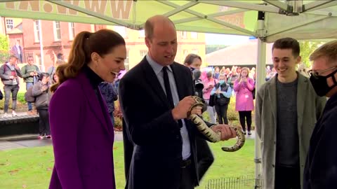 Britain's Kate and William hold tarantula and python