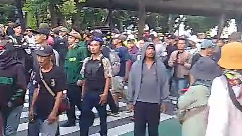 Crowds attend the legislative building in Jakarta