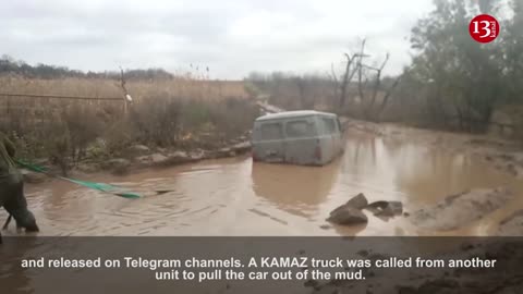 Russians are trying to get their UAZ vehicle unstuck from the mud