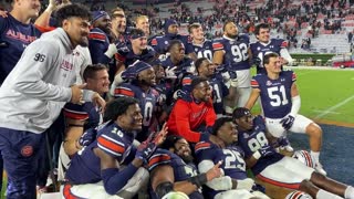 Auburn seniors receive game balls from interim head coach Cadillac Williams on senior day