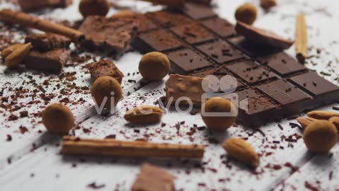 Black chocolate sweets and spices-Closeup of arranged mess of black chocolate bar with milk chocolat