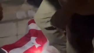 Columbia University - Pro-Palestine Protesters Dragging America Flag Across the Ground