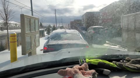 Driver Stops Traffic To Clear Off Snow Covered Car