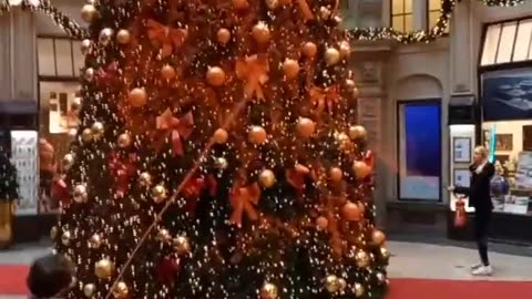 Climate activists target a Christmas tree, spraying it with orange paint in Germany.