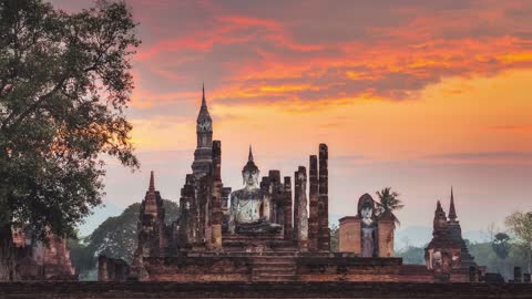 Sitting Budha At Sunset In Wat Mahathat Sukhothai Sky Background Loop Video (No Copyright)