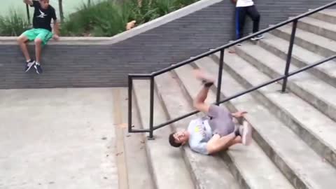 Parkour Guy Goes For A Front Flip But Lands Hard With His Head Banged Against Stairs