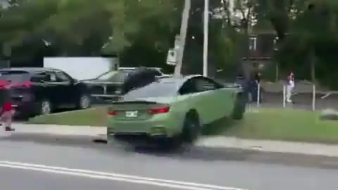 Stupid Driver Showing Off In A BMW Nearly Gets A Couple Of Pedestrians Killed