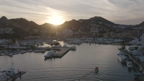 Aerial panorama of a tourist port at sunset