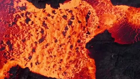 drone footage captures a lava flow during a volcanic eruption on Iceland’s Reykjanes