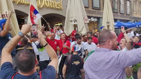 Serbs and Slovenes sing together at the Euro in Munich after their earlier match