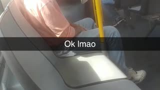 Person pink shirt phone mounted to yellow subway train bus pole